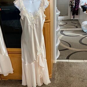 Chic Cream Sleeveless Dress with Floral Accents